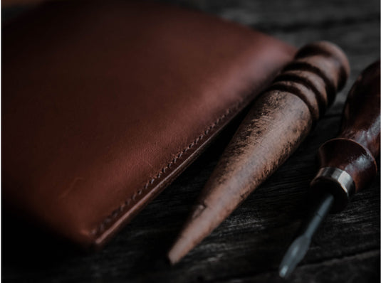 A leather bag filled with food and a flask of hot tea.
